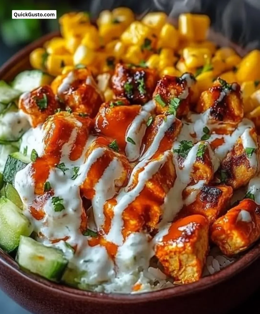 Delicious Buffalo Chicken Bowl topped with fresh ingredients and spicy sauce