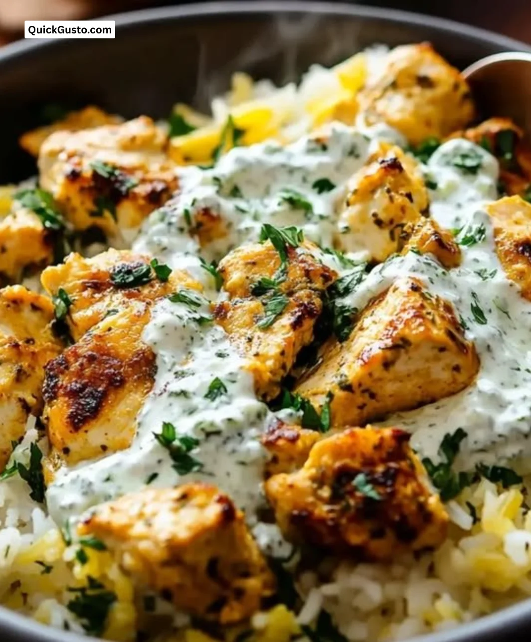 Delicious Dump-and-Bake Chicken Tzatziki served with rice on a dinner plate