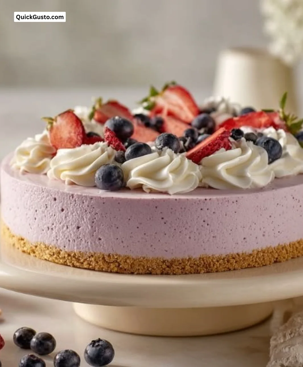 Easy no bake berry cheesecake topped with fresh berries and whipped cream