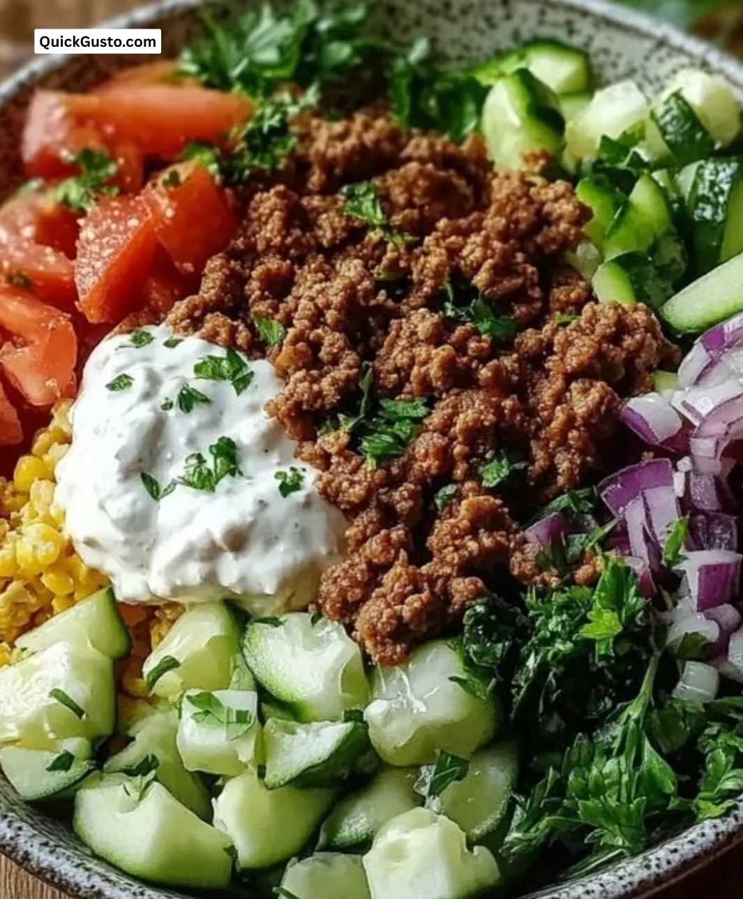 Delicious Greek Ground Turkey Gyro Bowl topped with fresh veggies and tzatziki sauce.