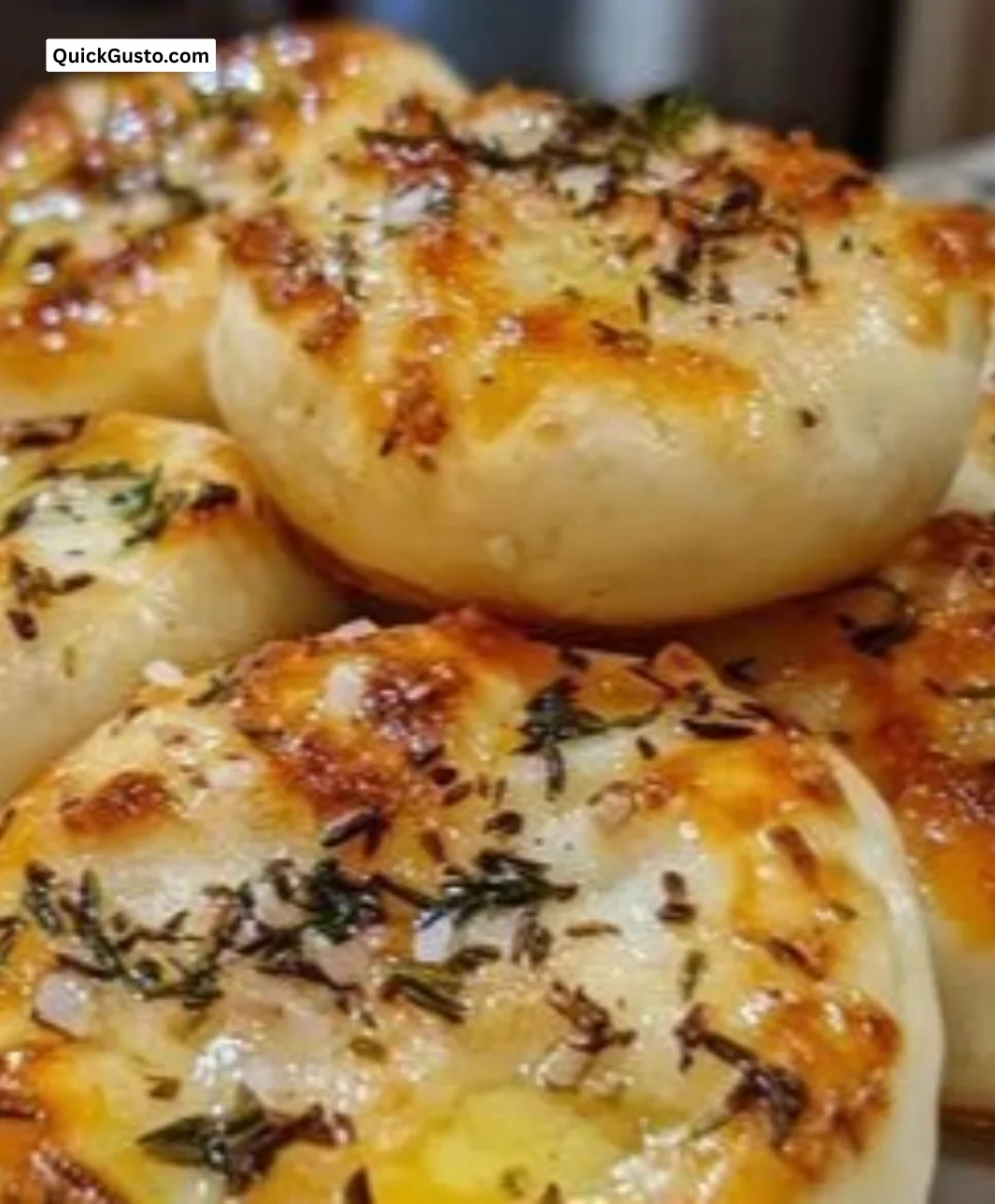 Golden crust garlic rosemary focaccia muffins with crispy edges and fragrant aroma