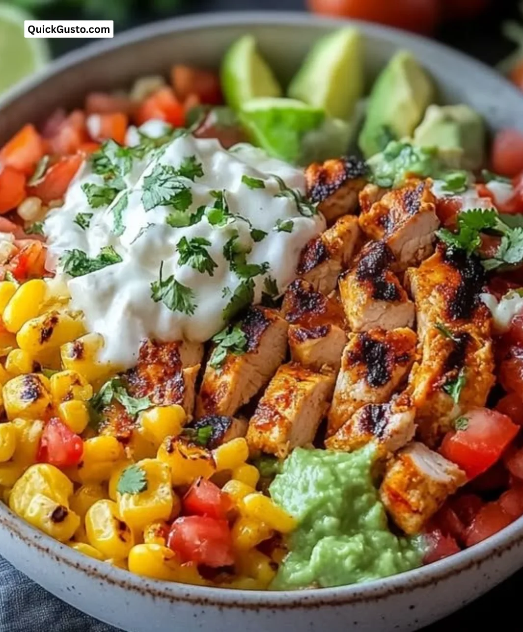 Colorful grilled chicken burrito bowls topped with fresh ingredients