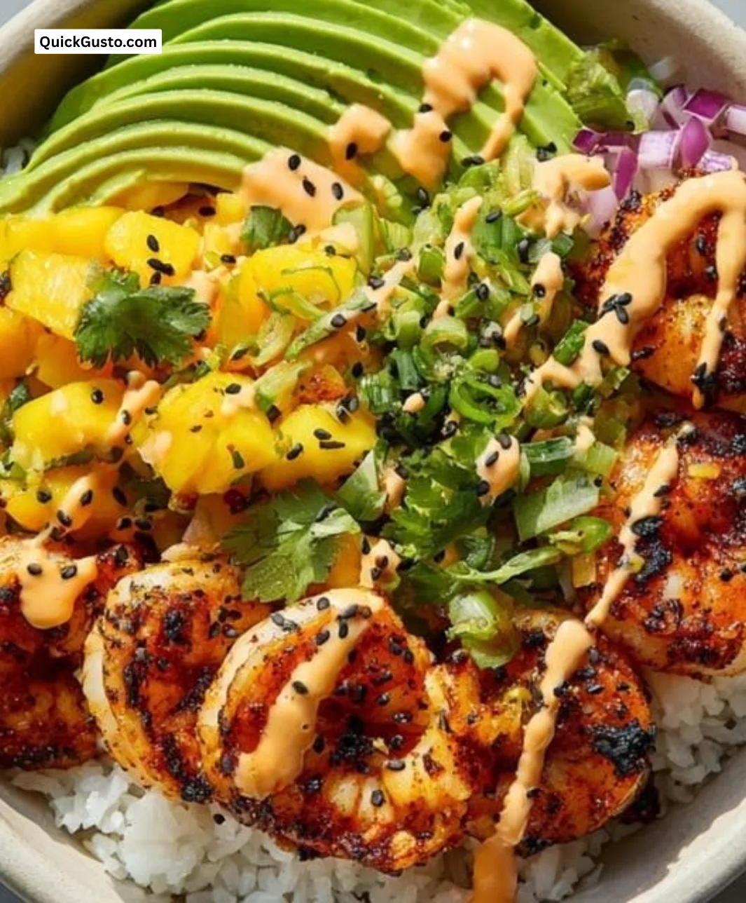 Healthy grilled shrimp and avocado bowls garnished with mango salsa