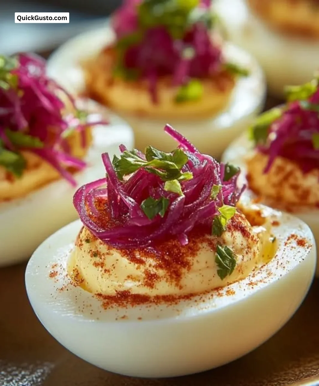 Delicious pickled onion deviled eggs served on a platter for snacking