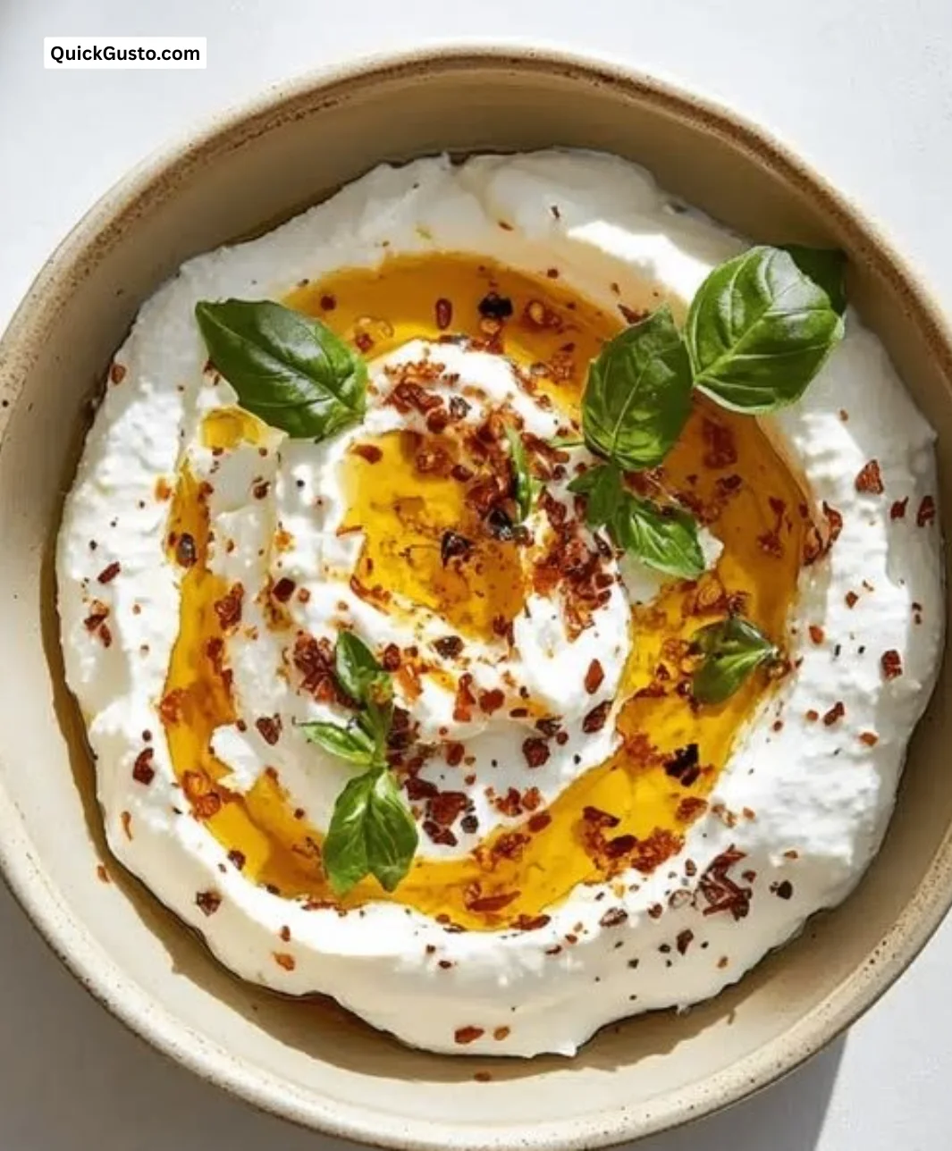 Irresistibly creamy burrata dip served with bread and vegetables