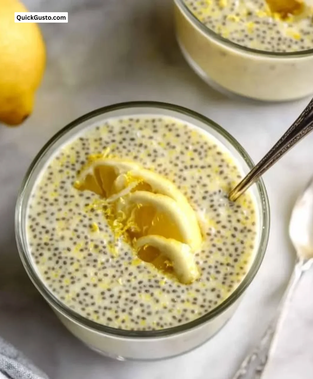 Creamy lemon chia pudding topped with fresh lemon zest and chia seeds