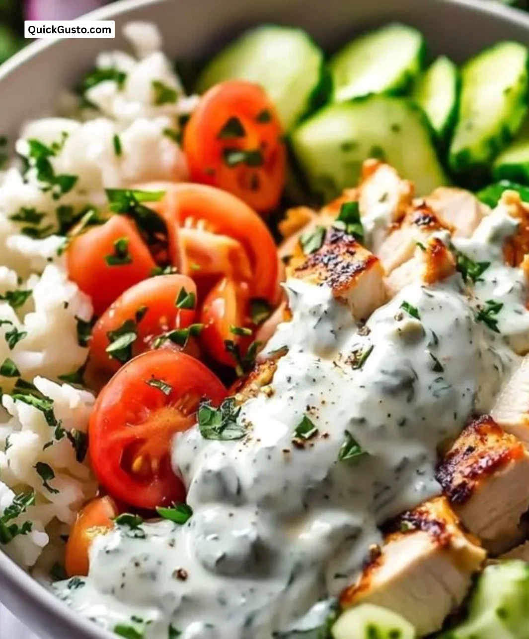 Delicious Greek Chicken Tzatziki Bowl filled with fresh ingredients and flavors.