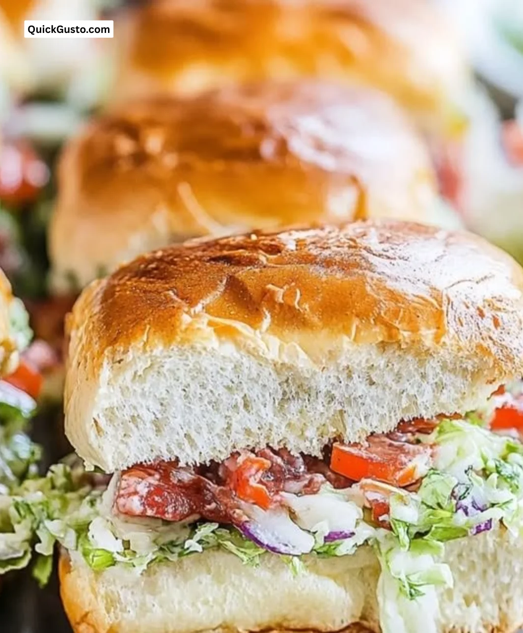 Delicious Italian Grinder Sliders on a wooden platter, ready to serve.