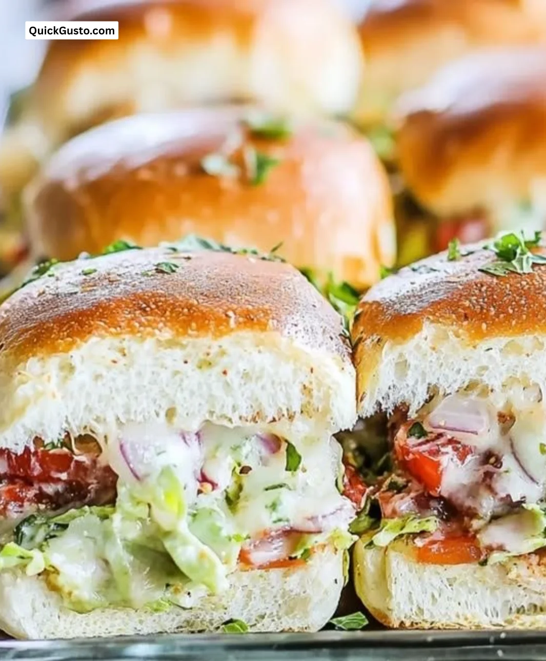 Delicious Italian grinder sliders served on a platter with fresh ingredients