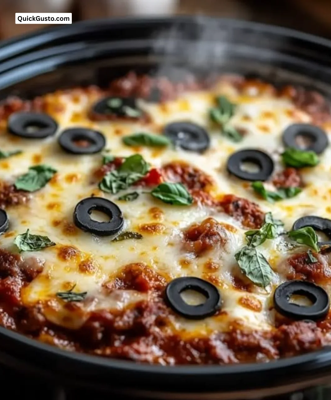 Keto Crock-Pot Pizza Casserole with cheese and toppings in a dish