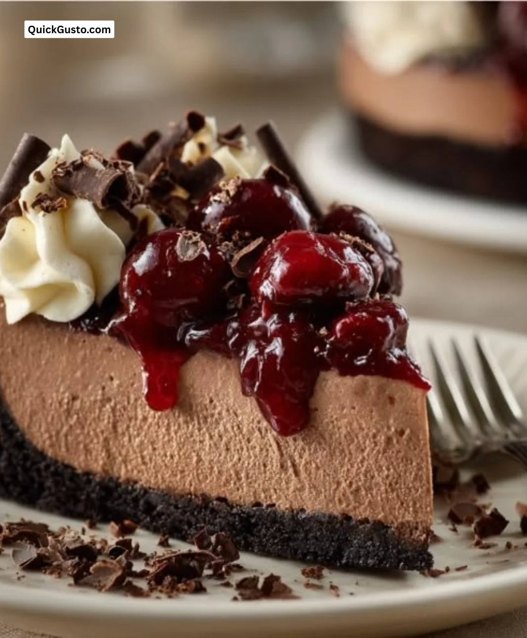 Delicious No Bake Black Forest Cheesecake topped with cherries and chocolate shavings.