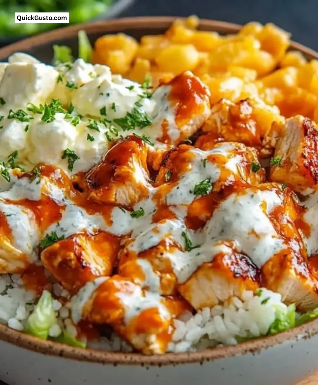 Buffalo Chicken Protein Bowl with fresh vegetables and dressing