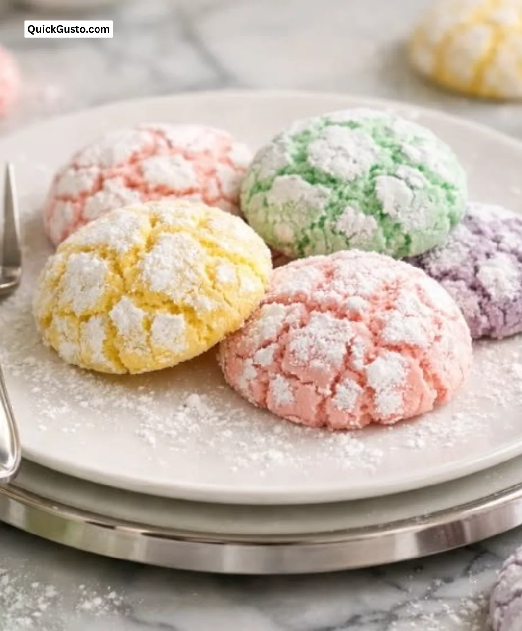 Freshly baked Springtime Crinkle Cookies dusted with powdered sugar