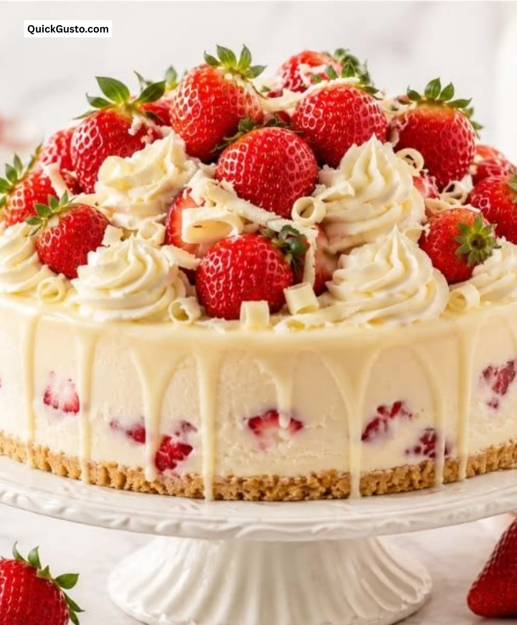 Summer slice of white chocolate cheesecake with fresh sun-kissed strawberries on top.