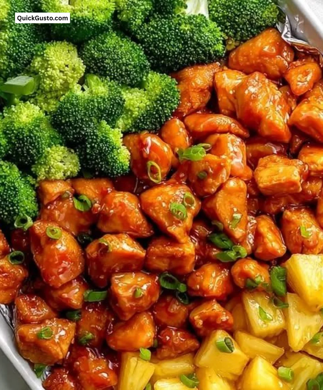 Teriyaki chicken with pineapple and broccoli on a sheet pan, ready to serve.