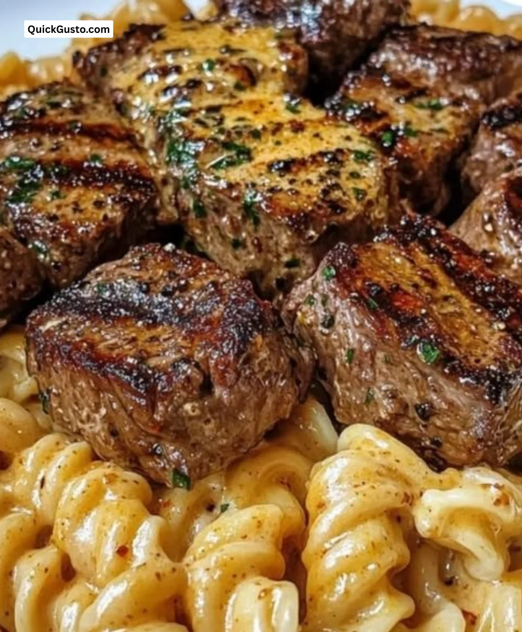 Creamy garlic butter steak bites served with pasta in a delicious dish