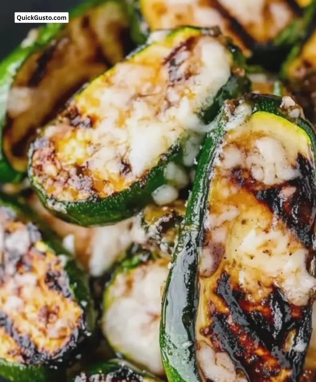 Balsamic grilled zucchini topped with Parmesan on a plate