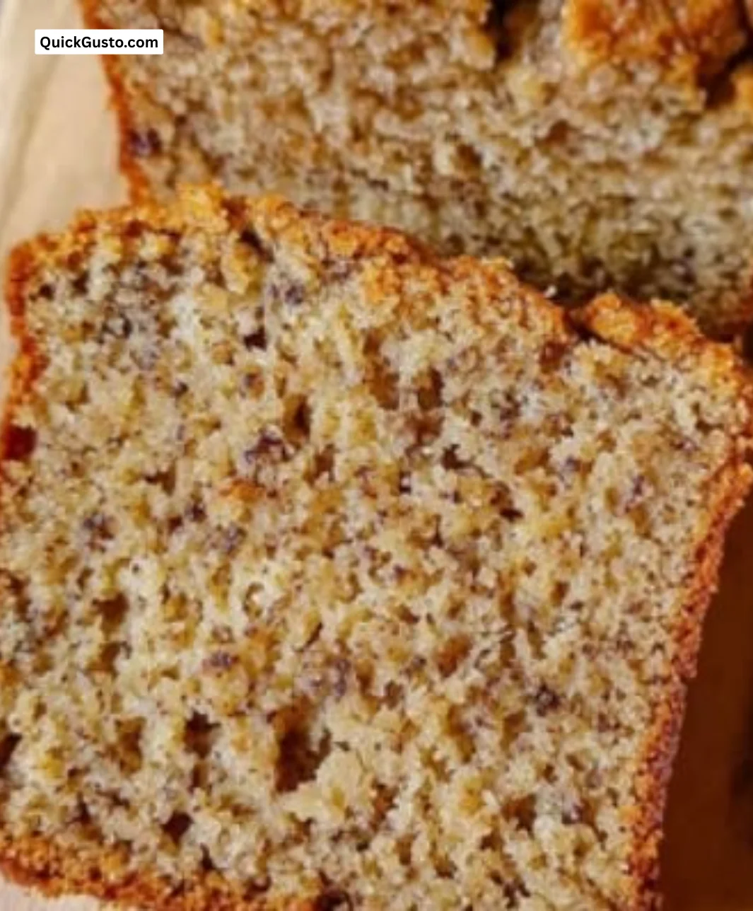 Deliciously moist banana bread slice on a wooden table