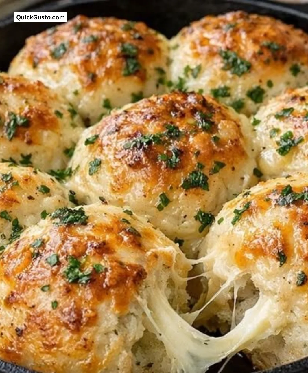 Cheesy herb and butter sourdough rolls fresh out of the oven