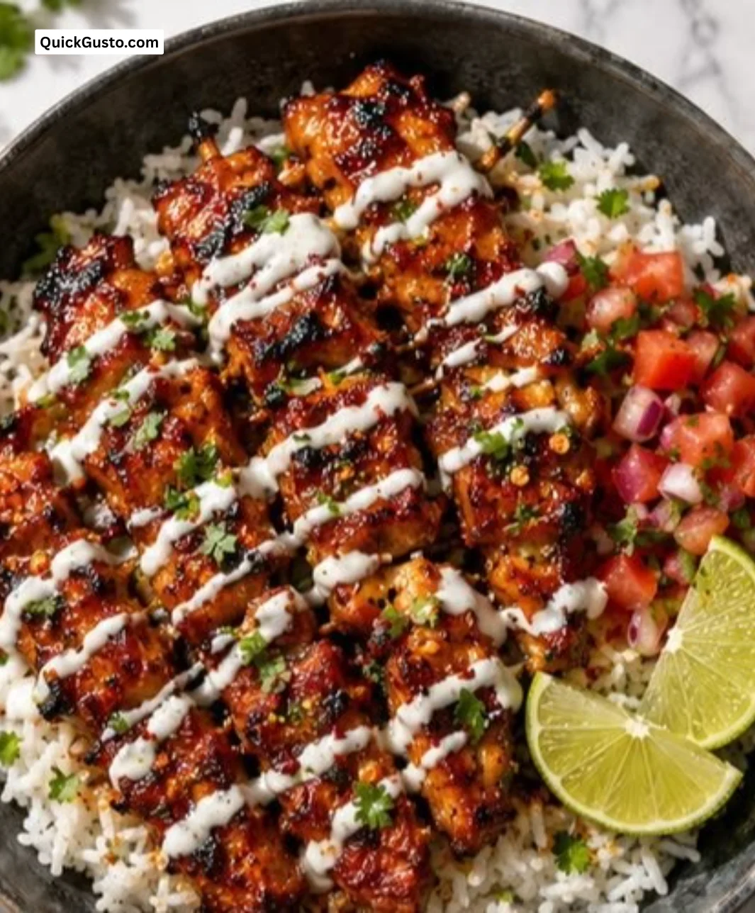 Chili Chicken Bowl topped with Coconut Lime Drizzle on a plate