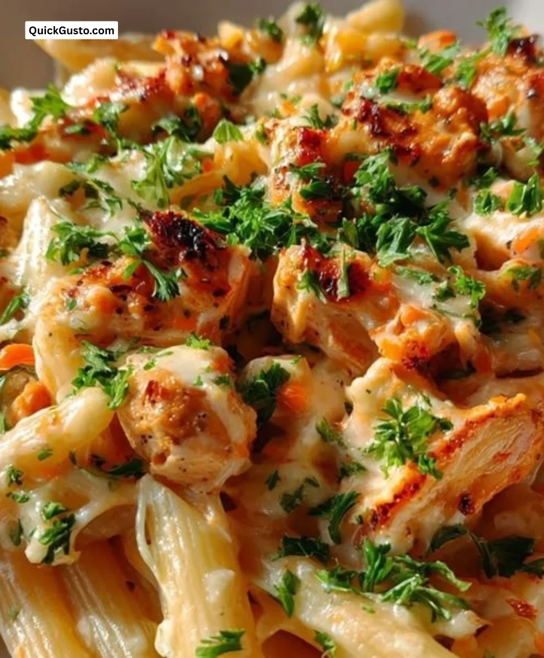 Creamy BBQ chicken penne with pepper jack cheese in a bowl
