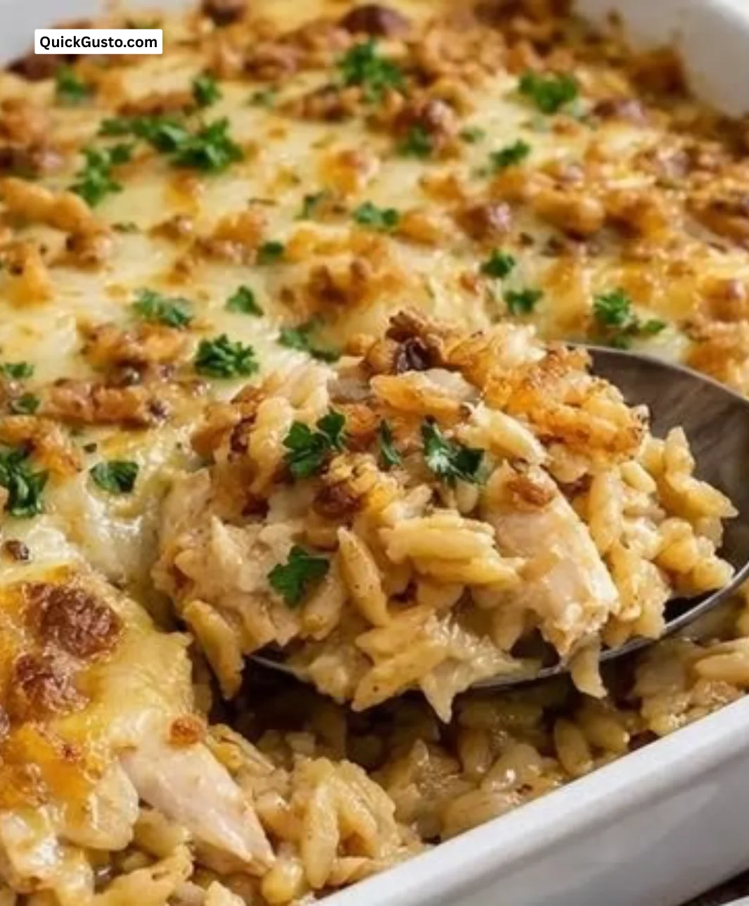 Creamy French Onion Chicken Orzo Casserole topped with melted cheese
