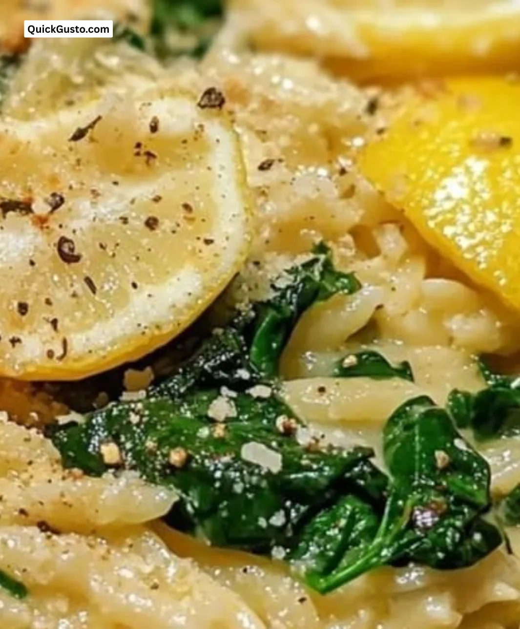 Creamy lemon spinach orzo served in a bowl with fresh ingredients