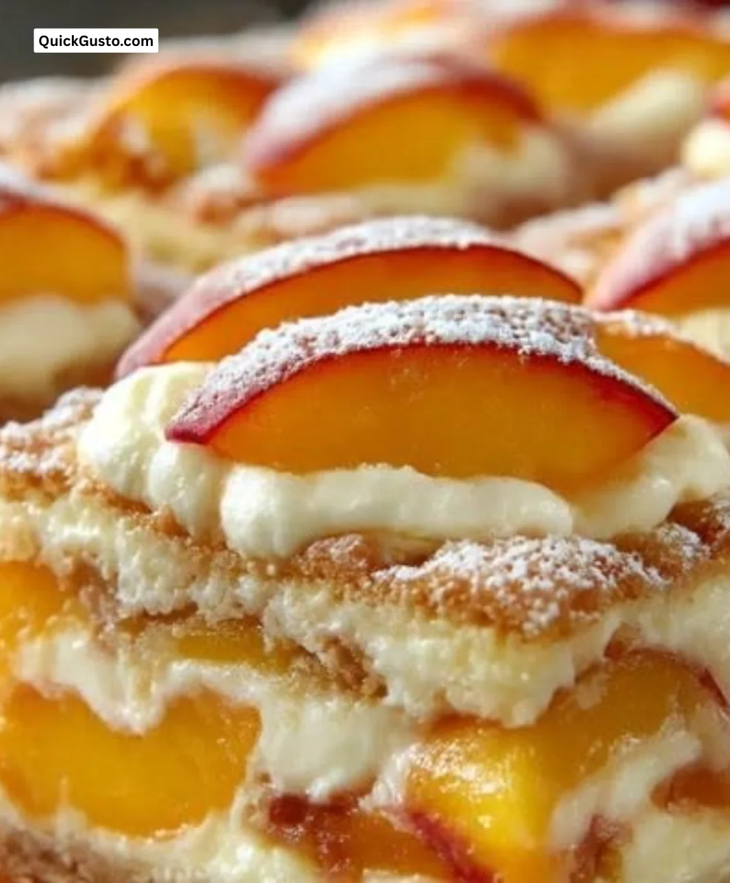 A close-up of creamy lemon truffles garnished with lemon zest and white chocolate.