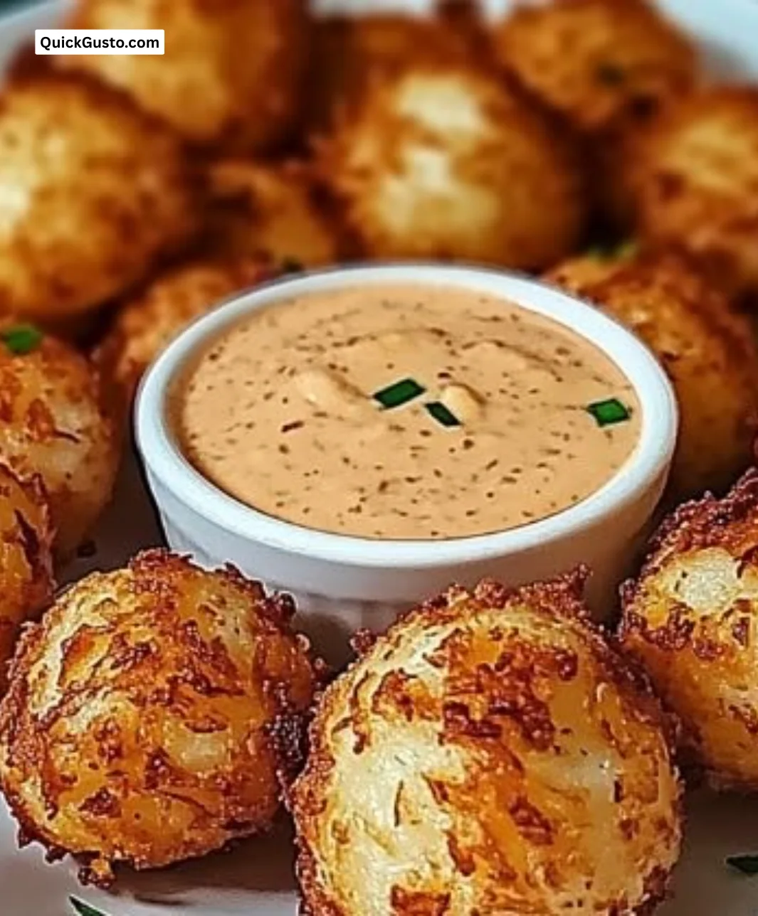 Crispy deep-fried onion balls served with zesty cajun ranch sauce