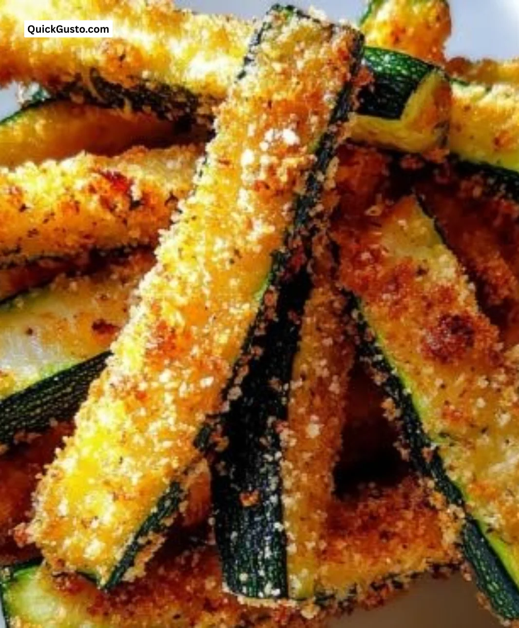 Crispy zucchini fries topped with parmesan cheese for a healthy snack