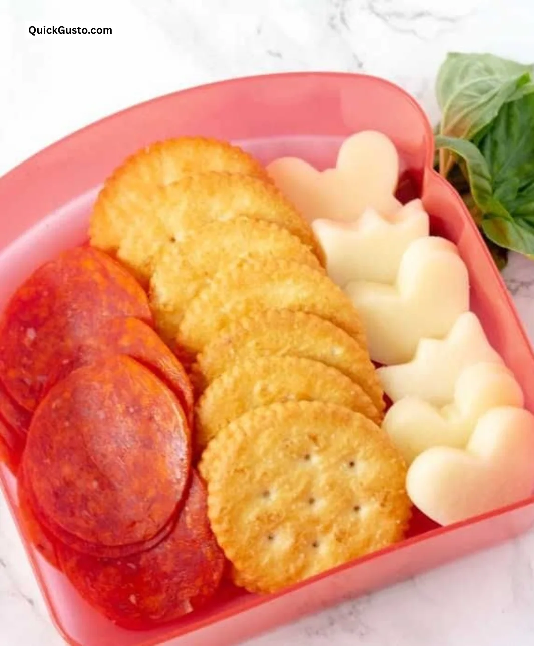 DIY pizza crackers Lunchable featuring crispy crackers, cheese, and toppings.