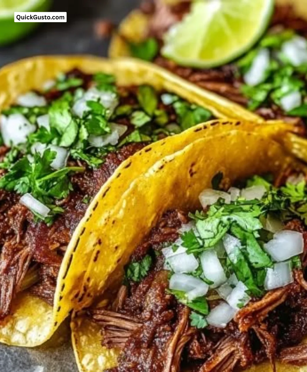 Delicious chuck roast tacos topped with fresh ingredients on a plate