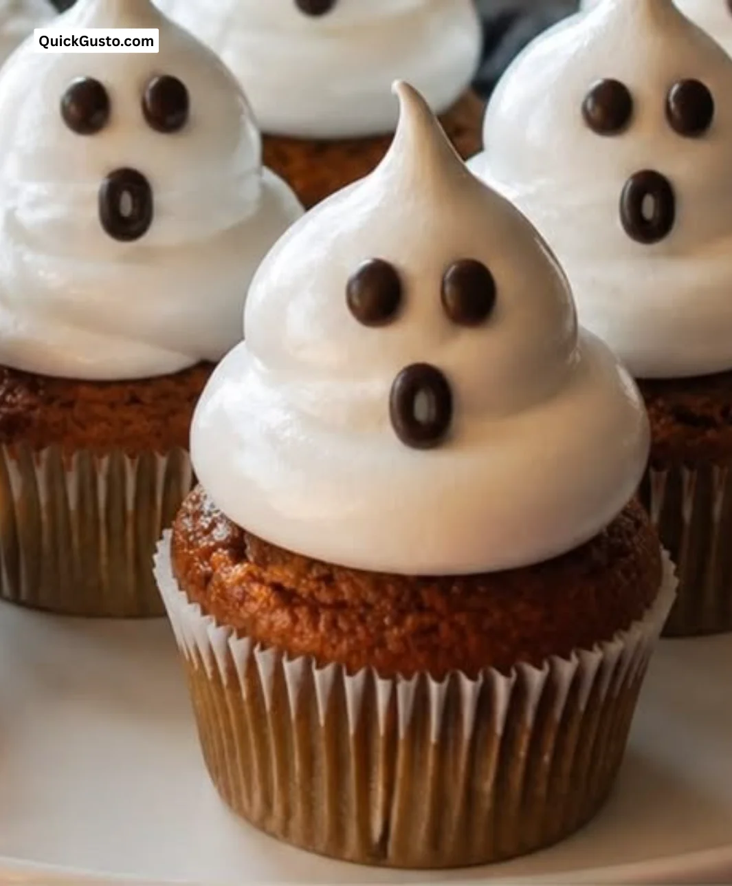 Spooky ghost cupcakes decorated for Halloween.