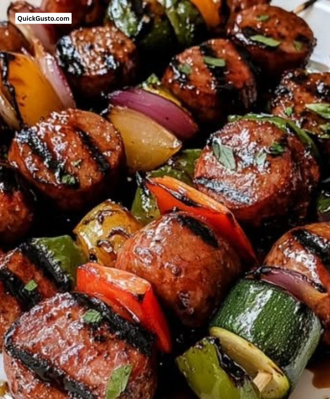 Grilled kielbasa kabobs with balsamic honey glaze on a platter