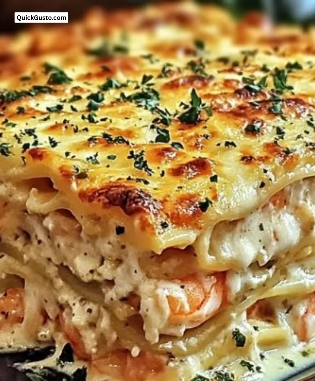 Delicious shrimp crab lasagna served in a dish with cheese and herbs.