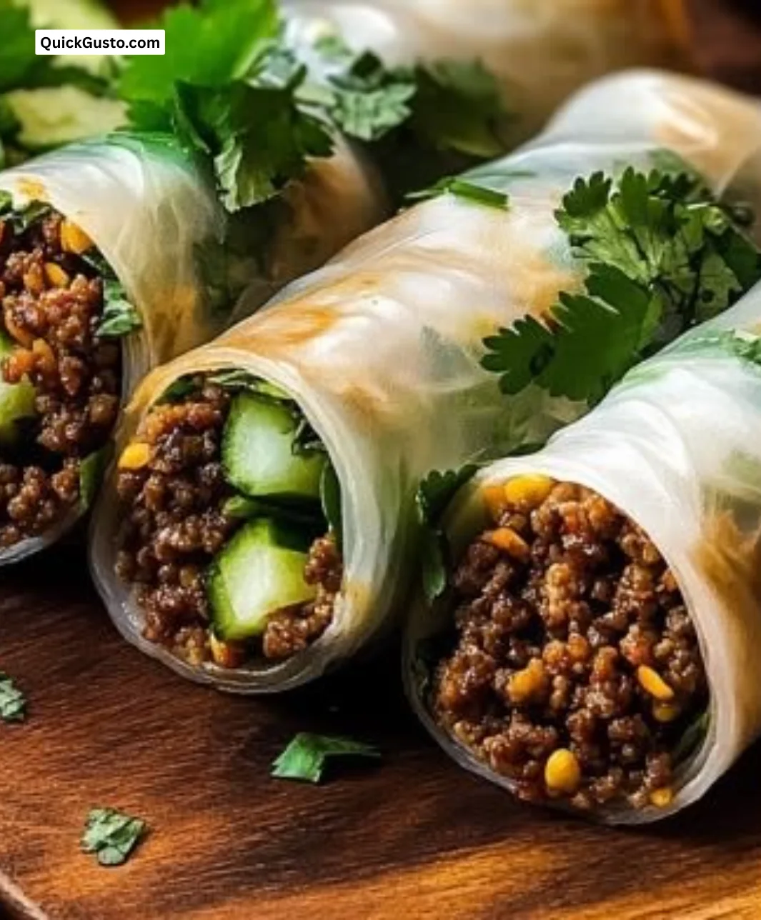 Plate of Thai Basil Beef Rolls garnished with fresh herbs and spices