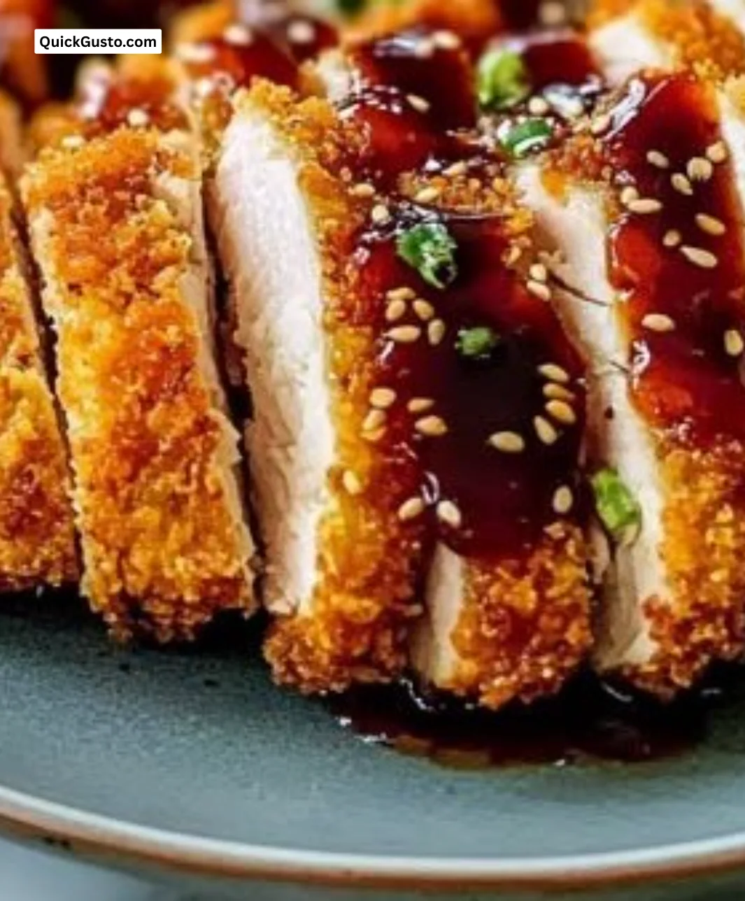 Plate of juicy Hawaiian Chicken Katsu with crispy breading and tropical garnish.