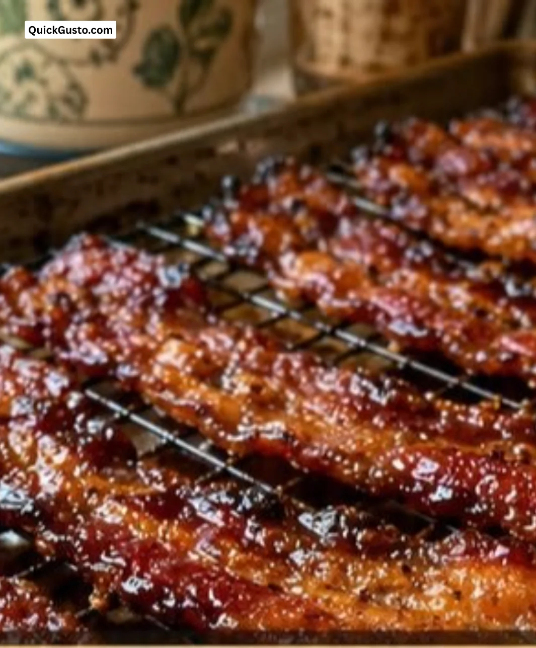 Plate of Million Dollar Bacon garnished with herbs and spices