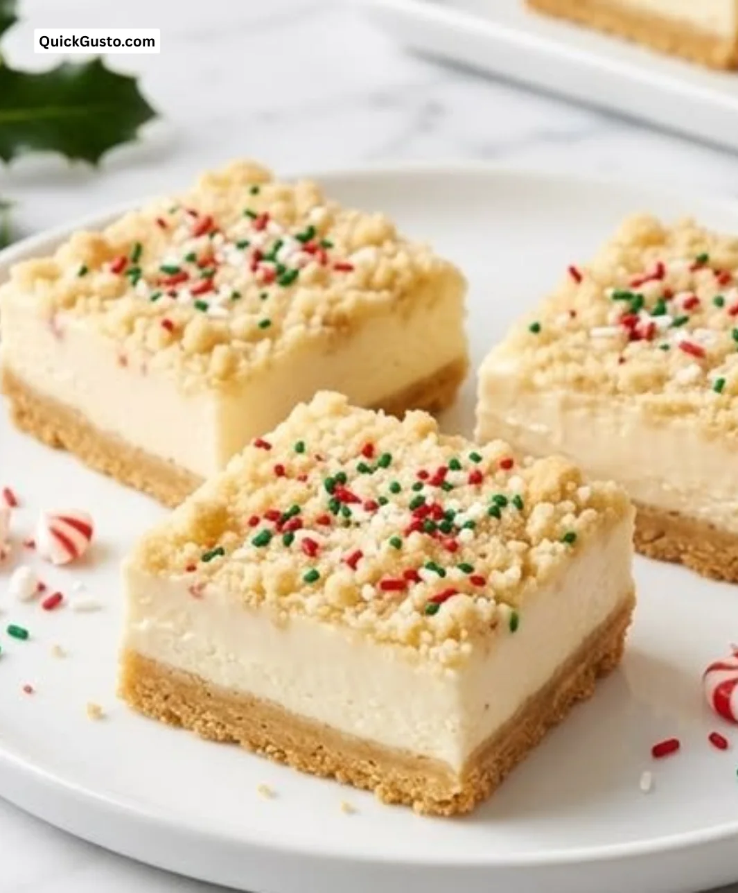 No-bake sugar cookie bars topped with colorful sprinkles on a white plate