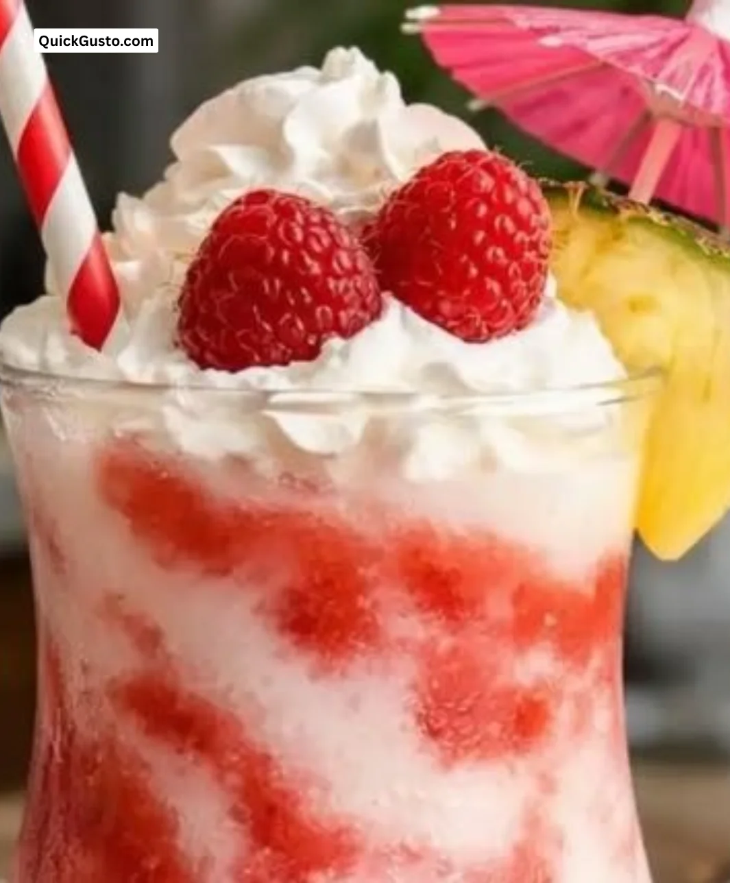 Raspberry Colada Twist cocktail featuring coconut, pineapple, and fresh raspberries.
