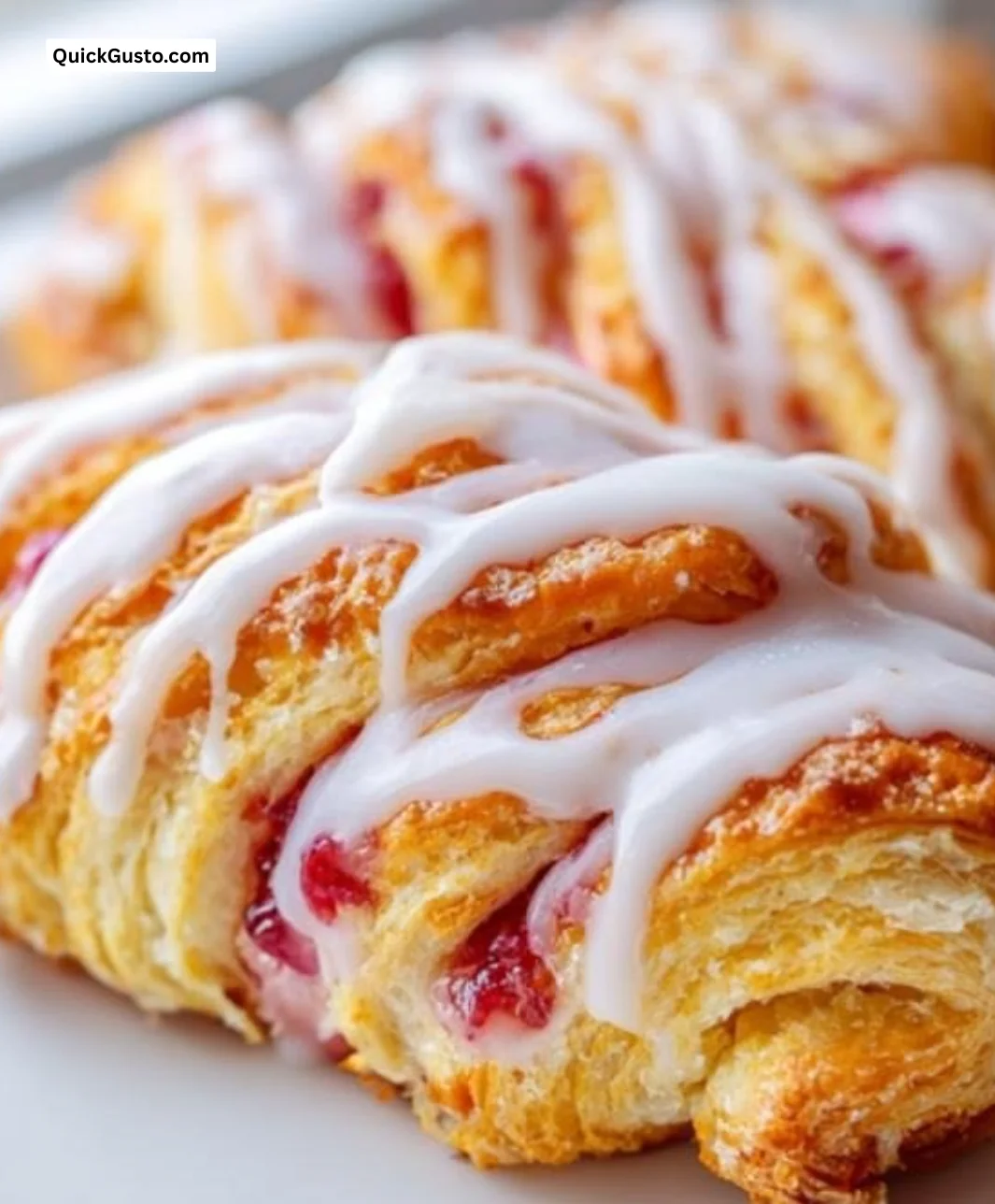 Rhubarb Danish Twists with flaky pastry and tangy filling on a rustic kitchen table