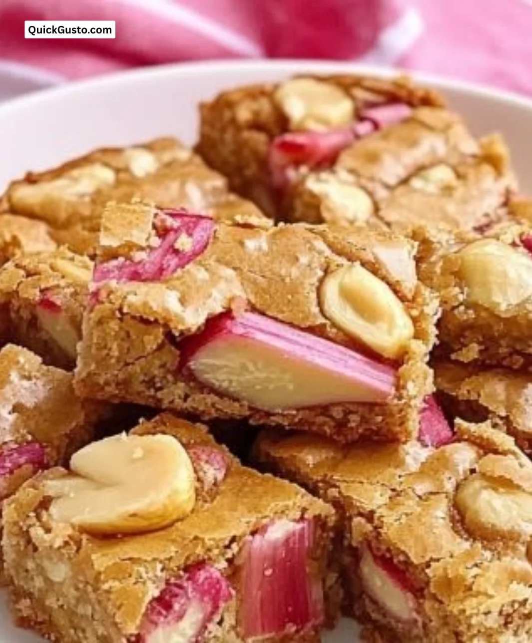 Delicious rhubarb macadamia blondies topped with fresh rhubarb and nuts.