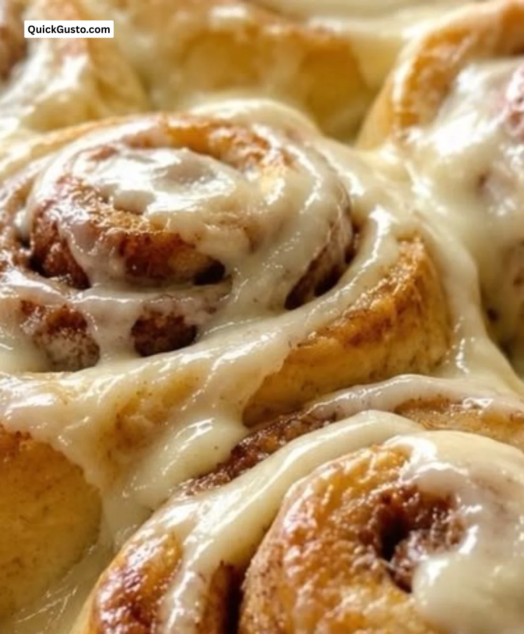 Freshly baked soft and gooey cinnamon rolls on a cozy kitchen table