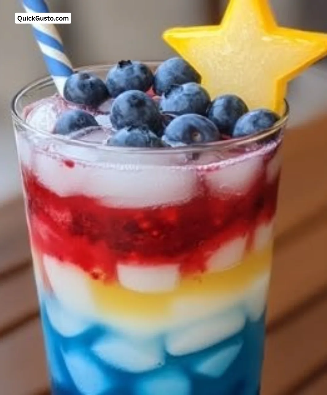 Star-Spangled Layered Lemonade in a glass, perfect for summer gatherings.