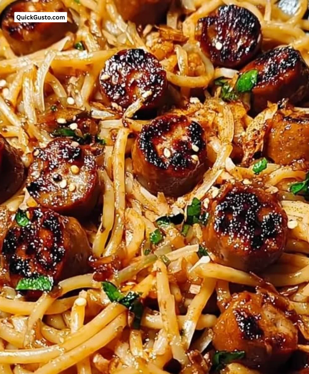 Sticky honey garlic sausage pasta skillet served in a cozy one-pan meal