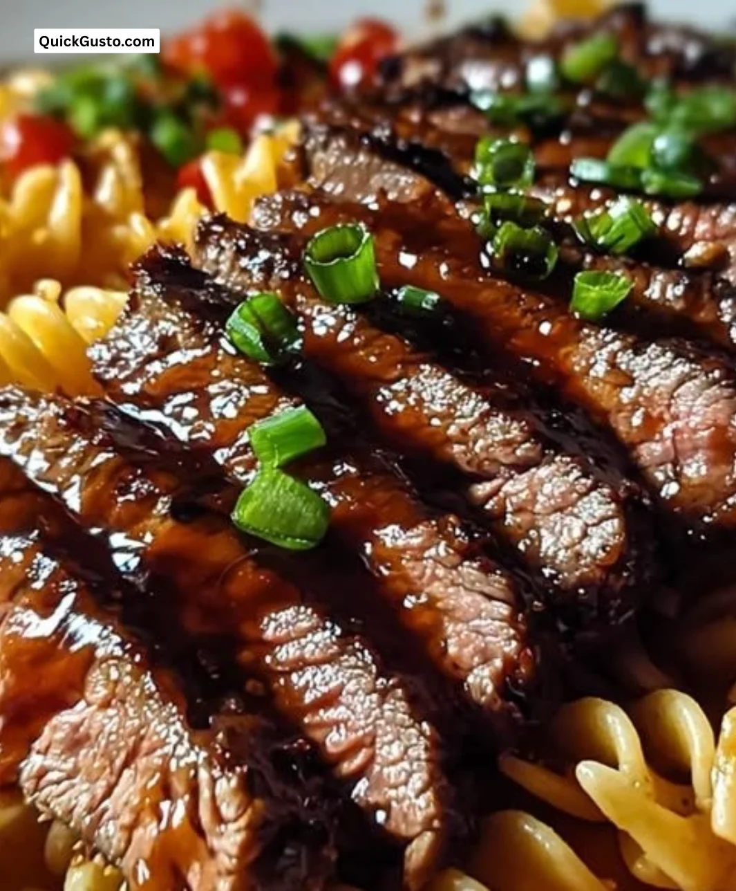Sticky honey garlic steak served with rotini pasta in a delicious sauce